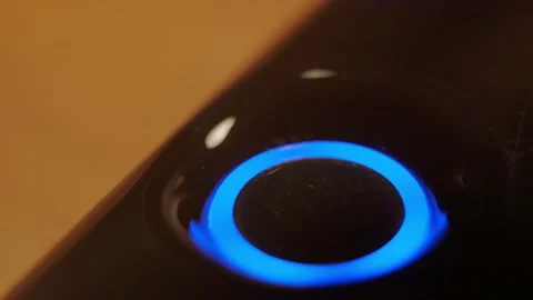 Turning on the blue-lit button Stock Footage 148044866