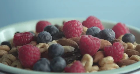 In turning on bowl with corn flakes rings poring a milk Stock Footage