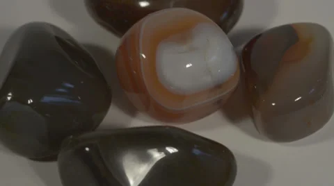 Turning brown agate - half-precious stones Stock Footage 37937146