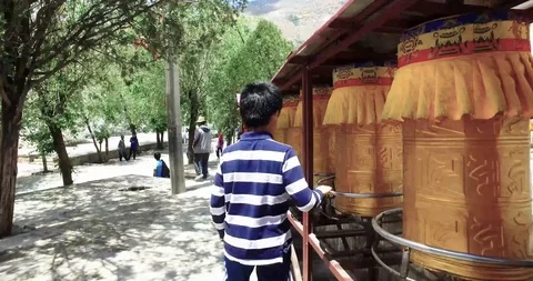 Turning Buddhist prayer wheels in Tibet close up view Stock Footage 93054953