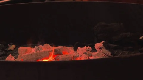 Turning Burning Coals, iron stick mixes burning coal Vídeo Stock 83790152