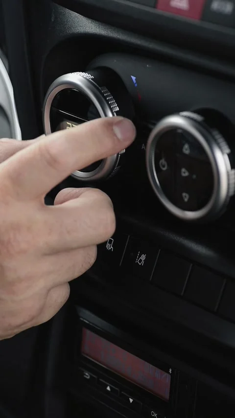 Turning car climate control down from hot to cold vertical Stock-Footage 340078185