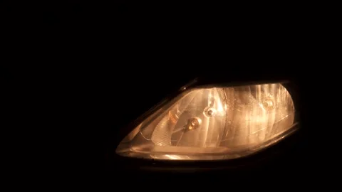 Turning car headlights on and off at nig... | Stock Video | Pond5