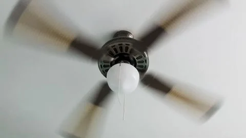 Turning Ceiling Fan. A Ceiling Fan in a House in Action Stock Footage 252996554
