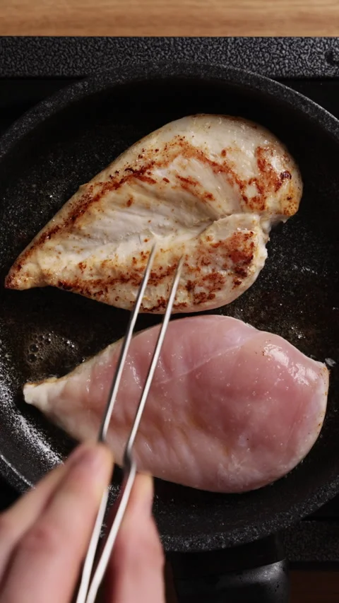 Turning Chicken Breasts In Frying Pan Vertical Top View Видео 336206567