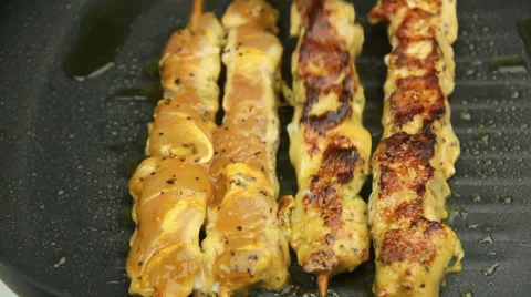 Turning Chicken Kebabs Over In Griddle Pan Stock Footage 38861487