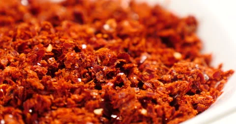 Turning chilli powder on a dish Stock Footage 162613842