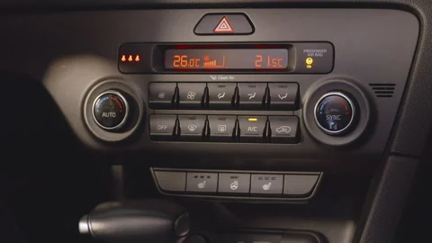 Turning on the climate control in the car. Adjusting car heating Stock Footage 258284370