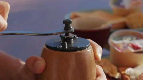 Turning the coffee grinder 002 Stock Footage 320669787