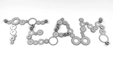 Turning cogwheels spelling TEAM Stock Footage