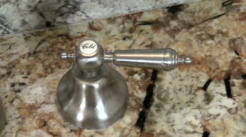 Turning cold water on off - HD Stock Footage 1004073