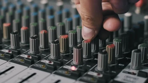 Turning Colorful Knobs on Audio Mixer Stock Footage 319067203