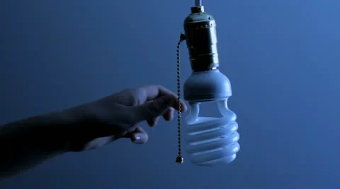 Turning on a compact florescent bulb Stock Footage 21944619