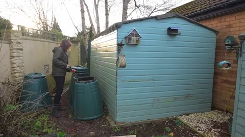 Turning the compost Stock Footage 321471240