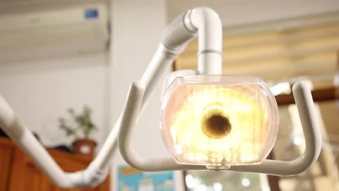 Turning on the dentist light bulb Stock Footage 142642063