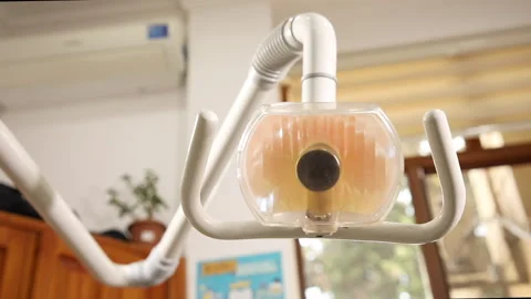 Turning on the dentist light bulb Stock Footage 142642274