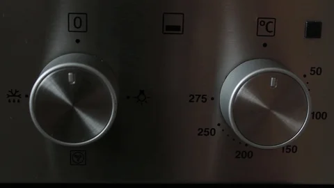 Turning dials, oven switched on 스톡 동영상 111763277
