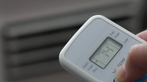 Turning Down Temperature on Thermostat in Summer in Hot Weather. Setting Di.. Stock Footage 312121107