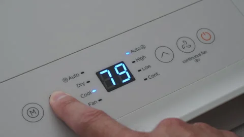 Turning Down Temperature on Thermostat in Summer in Hot Weather. Setting Di.. Stock Footage 312121119