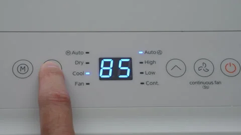Turning Down Temperature on Thermostat in Summer in Hot Weather. Setting Di.. Stock Footage 312121220