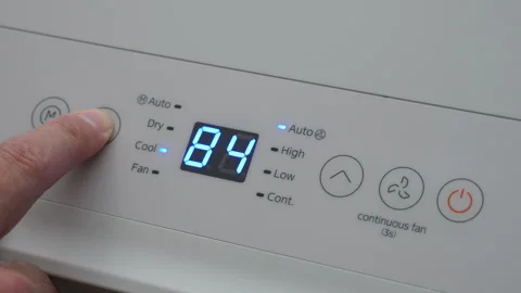 Turning Down Temperature on Thermostat in Summer in Hot Weather. Setting Di.. Stock Footage 312121225