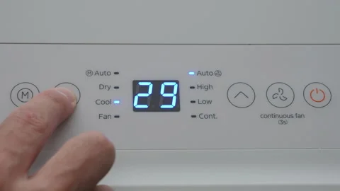 Turning Down Temperature on Thermostat in Summer in Hot Weather. Setting Di.. Stock Footage 312573848