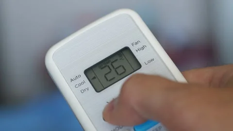 Turning Down Temperature on Thermostat in Summer in Hot Weather. Setting Di.. Stock Footage 312574325