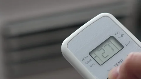 Turning Down Temperature on Thermostat in Summer in Hot Weather. Setting Di.. Stock Footage 312574343