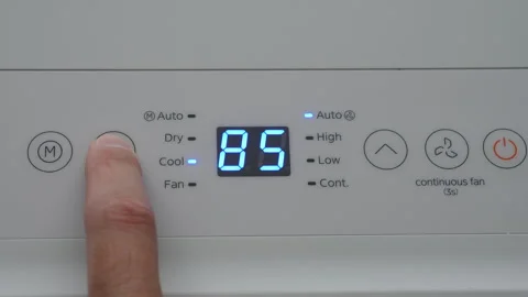 Turning Down Temperature on Thermostat in Summer in Hot Weather. Setting Di.. Video stock 331959311