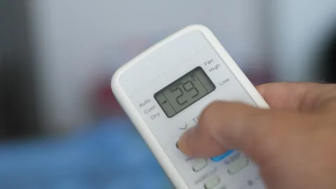 Turning Down Temperature on Thermostat in Summer in Hot Weather. Setting Di.. Stock Footage 337795485