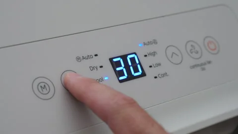 Turning Down Temperature on Thermostat in Summer in Hot Weather. Setting Di.. Stock Footage 337797419