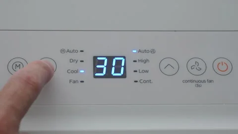 Turning Down Temperature on Thermostat in Summer in Hot Weather. Setting Di.. Stock Footage 337797443