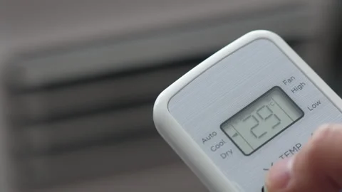 Turning Down Temperature on Thermostat in Summer in Hot Weather. Setting Di.. Stock Footage 337902611