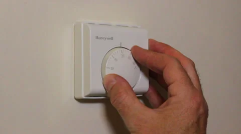 Turning down the thermostat Stock Footage 38194802