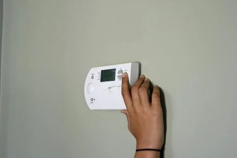 Turning Down Thermostat Stock Photos