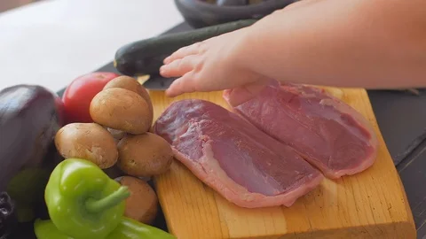 Turning duck breasts upside down Video stock 110025262