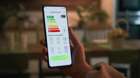 Turning on ECO mode using the energy efficiency rating app. Increasing savings Stock Footage 273829987