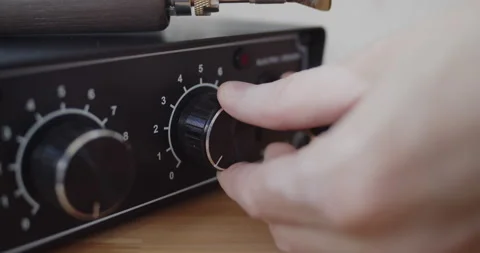 Turning on electric creasing and edging machine for leather work close-up Stock Footage 144890628
