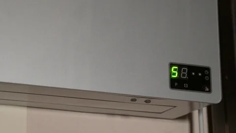 Turning on an electric heater Stock Footage 126530335