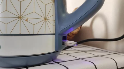 Turning On Electric Kettle Close Up, Preparing Hot Water for Tea or Coffee Stock-Footage 291302552
