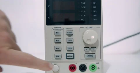 Turning on electronic power supply with red numbers on the screen Stock Footage 142960314