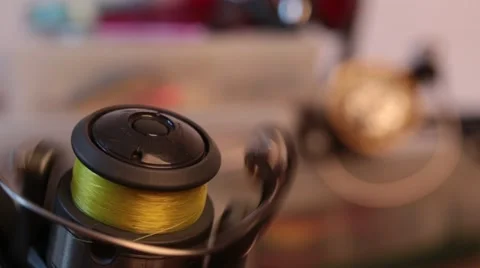 Turning fishing reel on background blur tackles Stock Footage 59087649