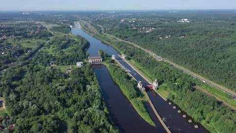 Turning flight above river locks and forest landscape Stock-Footage 321646083