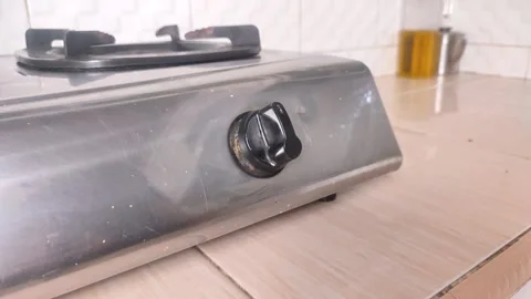 Turning off the gas stove in the kitchen Stock Footage 291970367