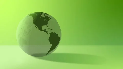 Turning green earth globe casting a shadow on a matching green background Video stock 314091090