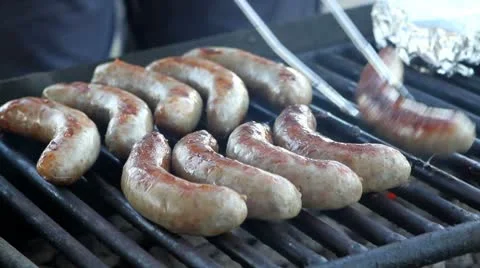 Turning Grilled Bratwurst Stock Footage 8911586