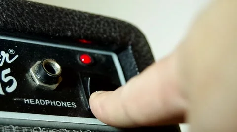 Turning on a  guitar amplifier Stock Footage 46832175