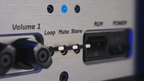 Turning on a guitar amplifier mute button Stock Footage 156636249