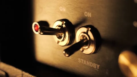 Turning on a guitar amplifier power switch slow motion macro closeup 스톡 동영상 142226012