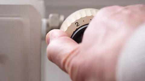 Turning on the heater at maximum setting. Close up of knob being turned. Stock Footage 220844369